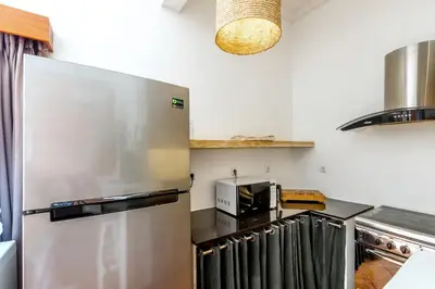 a kitchen with a large stainless steel refrigerator at La Villa Oberoi (2 BR) in Seminyak