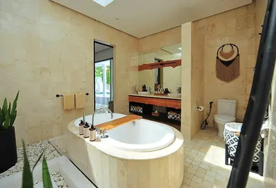 a large bathroom with a tub and a sink at Villa Zensa @ The Residence Seminyak in Seminyak