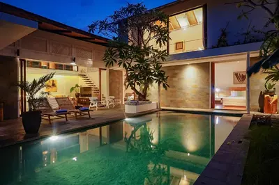 a swimming pool in the backyard of a house at Bias Villa Seminyak in Seminyak