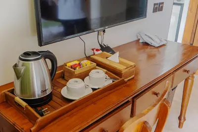a wooden table with a coffee maker on top of it at Villa Bulan Bali in Jimbaran