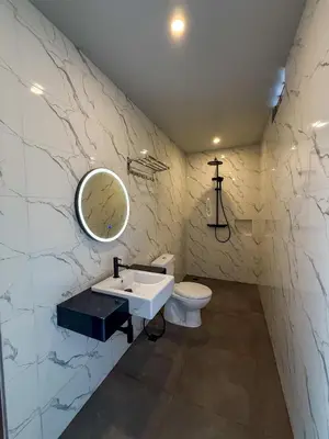 a bathroom with a sink and a toilet at Rahayu Guest House Seminyak in Seminyak