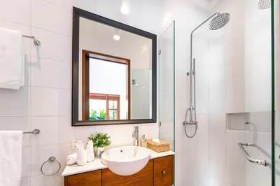 a bathroom with a sink and a mirror at Villa Bella Seminyak in Seminyak