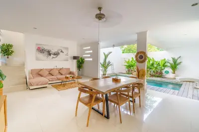 a living room with a table and a couch at Selog Seven in Seminyak