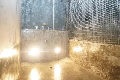 a bathroom with a sink and a tub with lights at PEKO VILLA - 1 BED - SEMINYAK in Seminyak