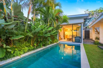 a swimming pool in the backyard of a house at 4 Bdr -Villa Donna, Fast Wi-Fi & Private Pool in Canggu