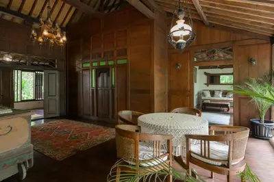 a dining room with a table and chairs at The Lavana Ziza Living And Villas Seminyak in Kerobokan