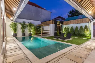 a swimming pool in the backyard of a house at Central 4 bedr villa 5min walk from eat street&Beach in Seminyak