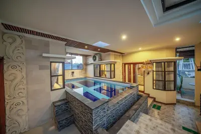 a swimming pool in a house at Padma Lodge Legian in Seminyak