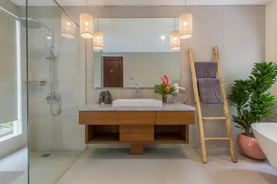 a bathroom with a sink and a mirror at Ajiorqo Villa in Seminyak