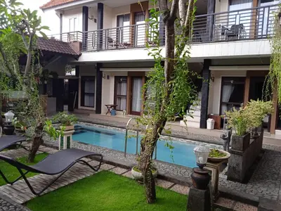 a view of the courtyard of a house with a swimming pool at NEW KUBU DI BUKIT apartemen & motor bike rental near beach and 10 minute to airpot in Jimbaran