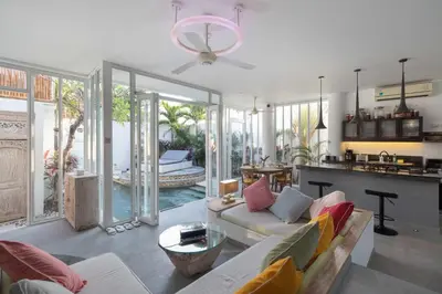 a living room with a couch and a table at PROMO Modern Seminyak Pvt Villa with Pool and Parking in Seminyak