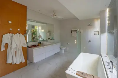 a bathroom with a tub and a sink and a shower at Lacasa3 Villa Legian With Butler in Legian