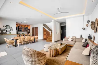 a living room with a couch and a table at Villa GoodFellas by BaliSuperHost in Seminyak