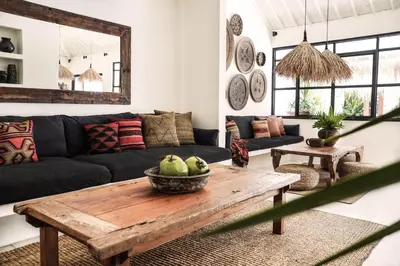 a living room with a couch and a table at Villa Obao in Seminyak