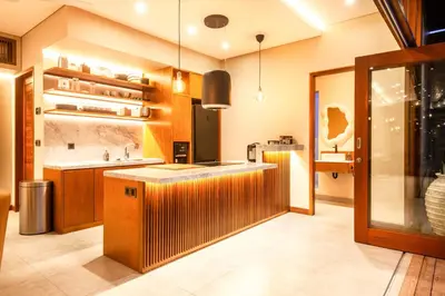 a large kitchen with a sink and a counter at Elegant 6BR Villa, Canggu, 400m to Finns Beach in Canggu