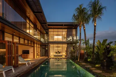 an exterior view of a house with a swimming pool at Marvelous 6BR, Panoramic Views, Ultimate Luxury in Canggu