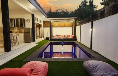 a swimming pool in the middle of a yard at Massive 6-bedroom Villa with 2 Pools in Seminyak