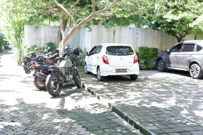 a group of motorcycles parked in a parking lot at Villa Bristol in Seminyak