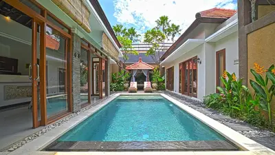 a swimming pool in the courtyard of a villa at Villa Searenity Seminyak in Seminyak
