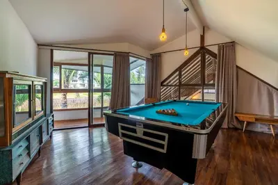 a large room with a pool table in it at Villa Tarita Canggu in Kerobokan