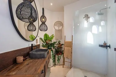 a bathroom with a sink and a mirror at Villa Lagertha by Optimum Bali Villas in Kerobokan