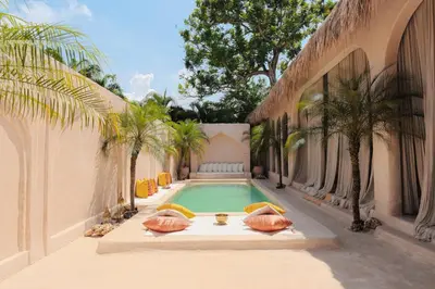 a swimming pool in the middle of a building at The Oasis Bali in Canggu