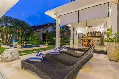 a villa with a swimming pool and a patio at Central & Charming 3bedr with private pool in Seminyak