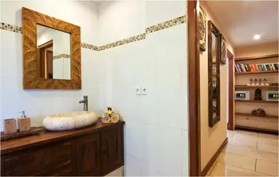 a bathroom with a sink and a mirror at 6BR Villa Sensel - Minggu Villas Seminyak in Seminyak