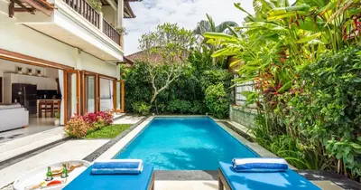 a swimming pool in the backyard of a house at Taman Hijau Villa by iBali Management in Kerobokan