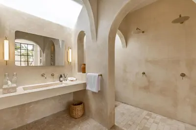 a bathroom with a sink and a mirror at Private Pool Villa Bocami Suites- 1 by OriVista in Kerobokan