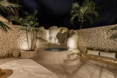a bathroom with a water fountain in a resort at Private Pool Villa Bocami Suites- 1 by OriVista in Kerobokan