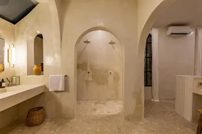 a bathroom with a shower and a sink at Private Pool Villa Bocami Suites- 2 by OriVista in Kerobokan