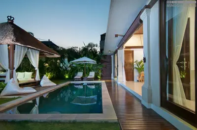 a swimming pool in the backyard of a house at 8BR Villa Mason - Minggu Villas in Seminyak