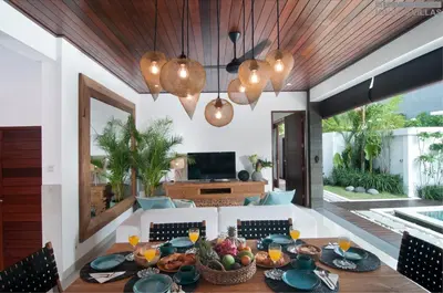 a dining room with a table with fruit on it at 8BR Villa Mason - Minggu Villas in Seminyak