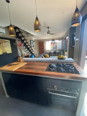a kitchen with a stove and a counter top at ZenBali 1 Villa Canggu in Canggu