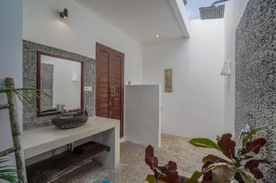 a bathroom with a sink and a mirror at Villa Art Gecko, 2BR private haven in Heart of Batu Belig, Seminyak in Canggu