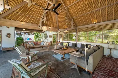 a living room with a couch and a table at Gorgeous Balinese Designed 3 Bed Villa, Top Pick! in Seminyak