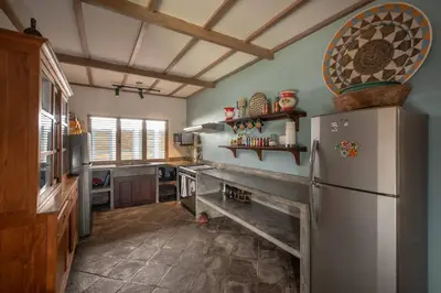 a kitchen with a refrigerator and a stove in it at Gorgeous Balinese Designed 3 Bed Villa, Top Pick! in Seminyak