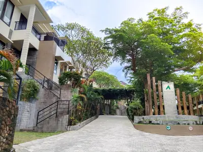 a building with a walkway in front of it at Abisha Villa Jimbaran in Jimbaran