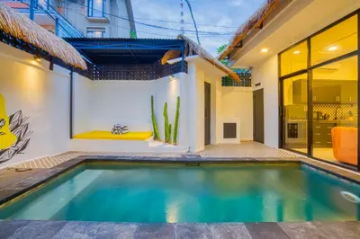 a swimming pool in the backyard of a house at Villa Canberra - Seminyak in Seminyak