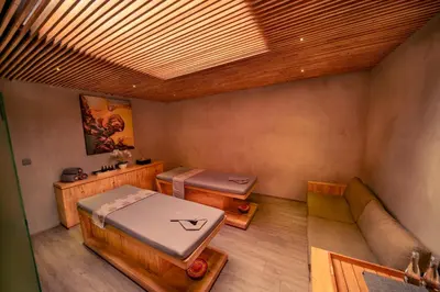 an overhead view of a room with a bed and a couch at INSPIRA Seminyak in Seminyak