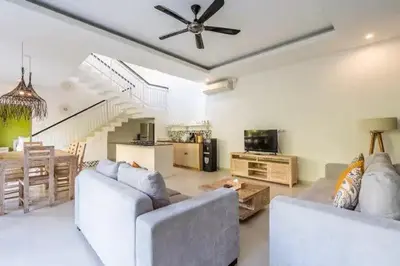 a living room with two couches and a ceiling fan at NEW Villa Indah Seminyak 3BR Private Pool in Seminyak
