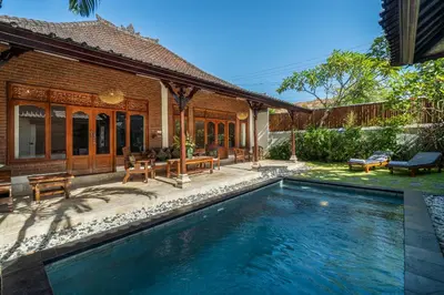 a swimming pool in the backyard of a house at Villa Kori Bali Kubu, 9 people maximum, close to Seminyak Beach in Seminyak