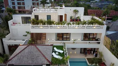 an aerial view of a white building with a swimming pool at Premium 5 bd Luxury Central Villa 300m to beach & Ku De Ta in Seminyak