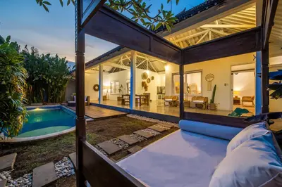 an exterior view of a house with a swimming pool at Villa Seminyak - 2bdr private big pool villa in Seminyak