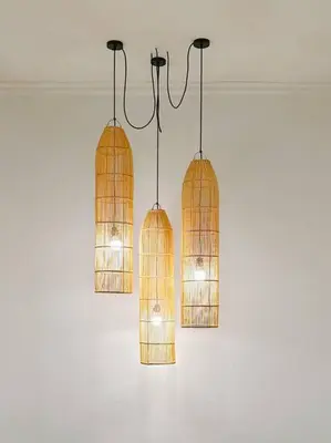 two pendant lights are hanging from a ceiling at Villa Sriwedari - Seminyak in Seminyak