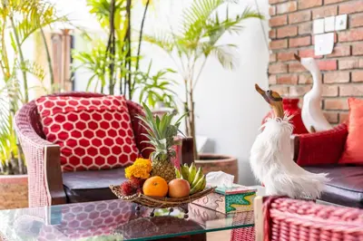 a living room with a table with a chicken on it at Villa Lollie Seminyak in Seminyak