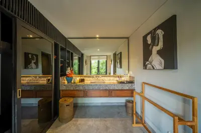 a bathroom with two sinks and a large mirror at Villa De Suma - Fully Staffed Luxury Villa, Central Seminyak, walk to the beach in Seminyak