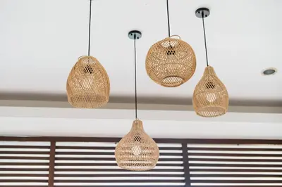 a group of three lights hanging from a ceiling at Bali Radiance Villas Seminyak in Seminyak