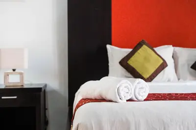 a hotel room with a bed with towels on it at Bali Radiance Villas Seminyak in Seminyak